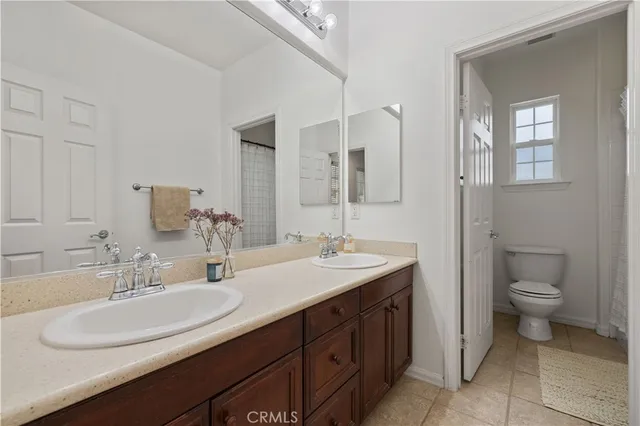 an aerial view of residential houses with outdoor space and seating