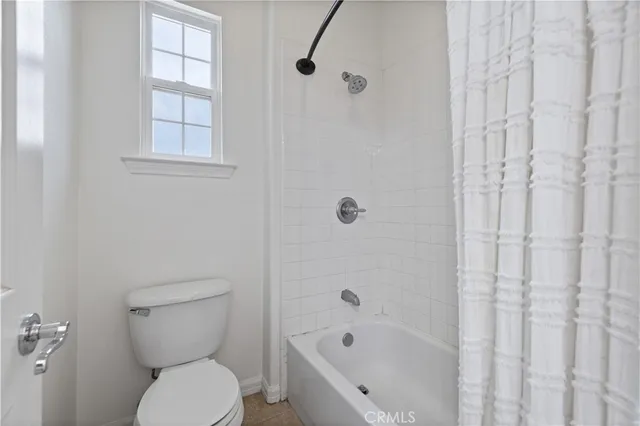 an aerial view of residential houses with outdoor space and river