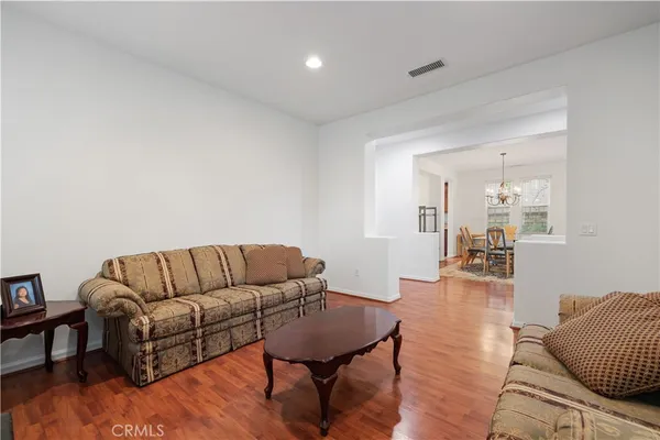 a kitchen with stainless steel appliances granite countertop a sink a stove and a microwave