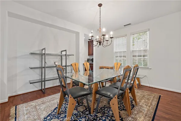 a living room with furniture window and wooden floor