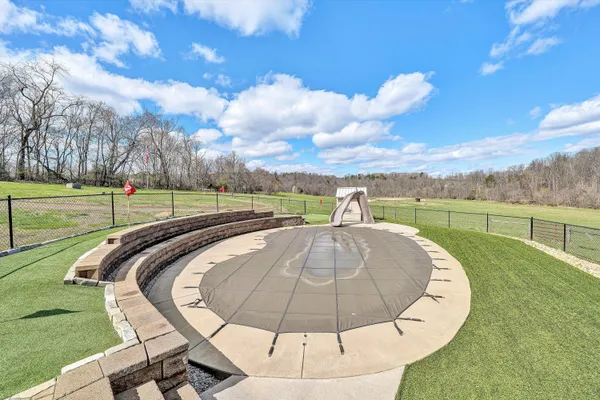 a view of dirt field with trees