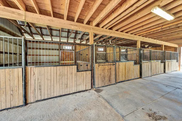 a view of house with backyard and trees