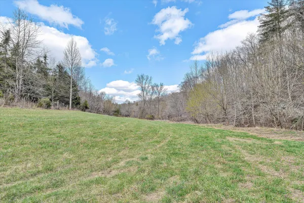 a living room with fireplace and a flat screen tv