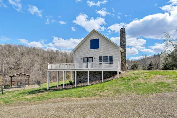 a kitchen with granite countertop a refrigerator stove and microwave