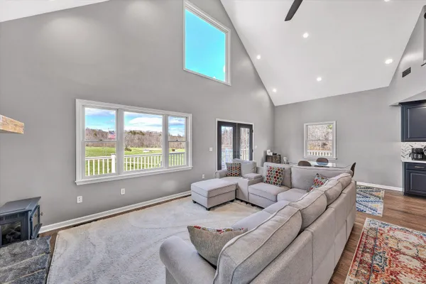 a bathroom with a granite countertop sink mirror and cabinets