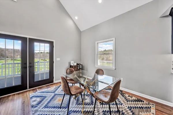 a bathroom with a double vanity sink a mirror and a shower