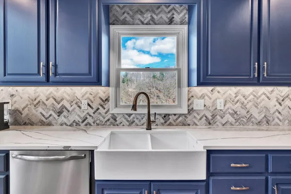 a living room with a bed furniture and a window