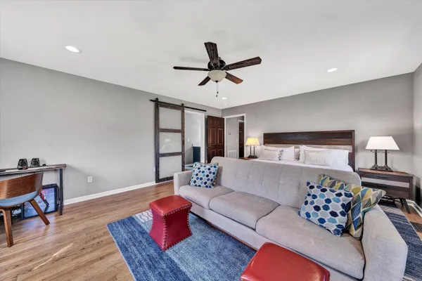 a bedroom with bed and window