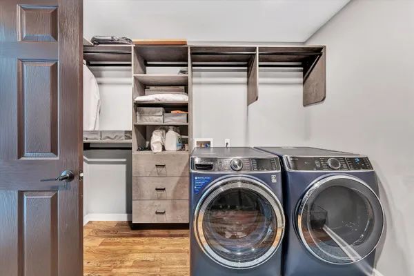 a view of house with yard and swimming pool