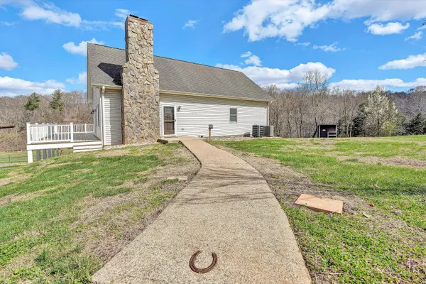 an outdoor view with a swimming pool and outdoor space