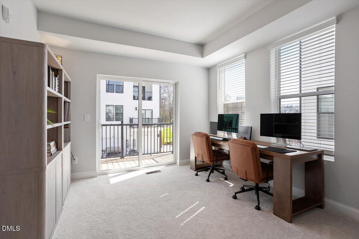 1234 Coach Sta Alley, Unit 101 Raleigh, NC 27601 - Photo 20 of 30 a view of a livingroom with workspace and a window