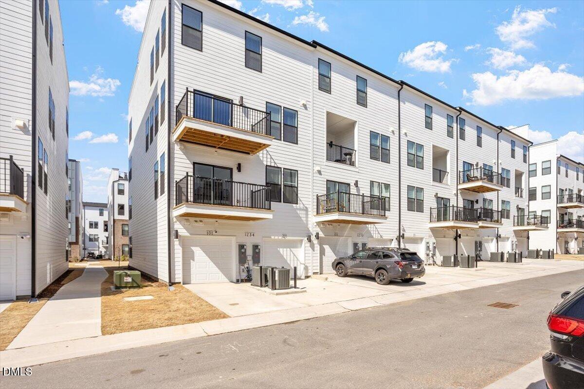 1234 Coach Sta Alley, Unit 101 Raleigh, NC 27601 - Photo 26 of 30 a front view of a building with a street