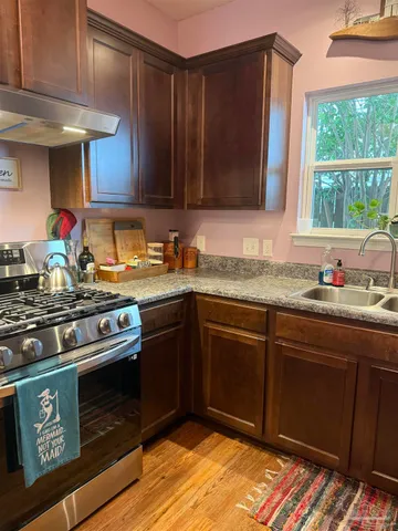 a bathroom with a toilet a sink and a mirror