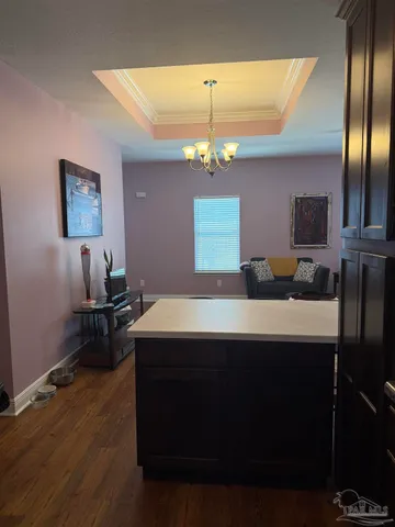 a view of a patio with table and chairs with wooden floor and fence