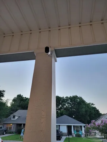 a living room with couches a dining table and chairs with wooden floor