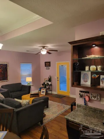 a kitchen with granite countertop stainless steel appliances a sink stove and cabinets