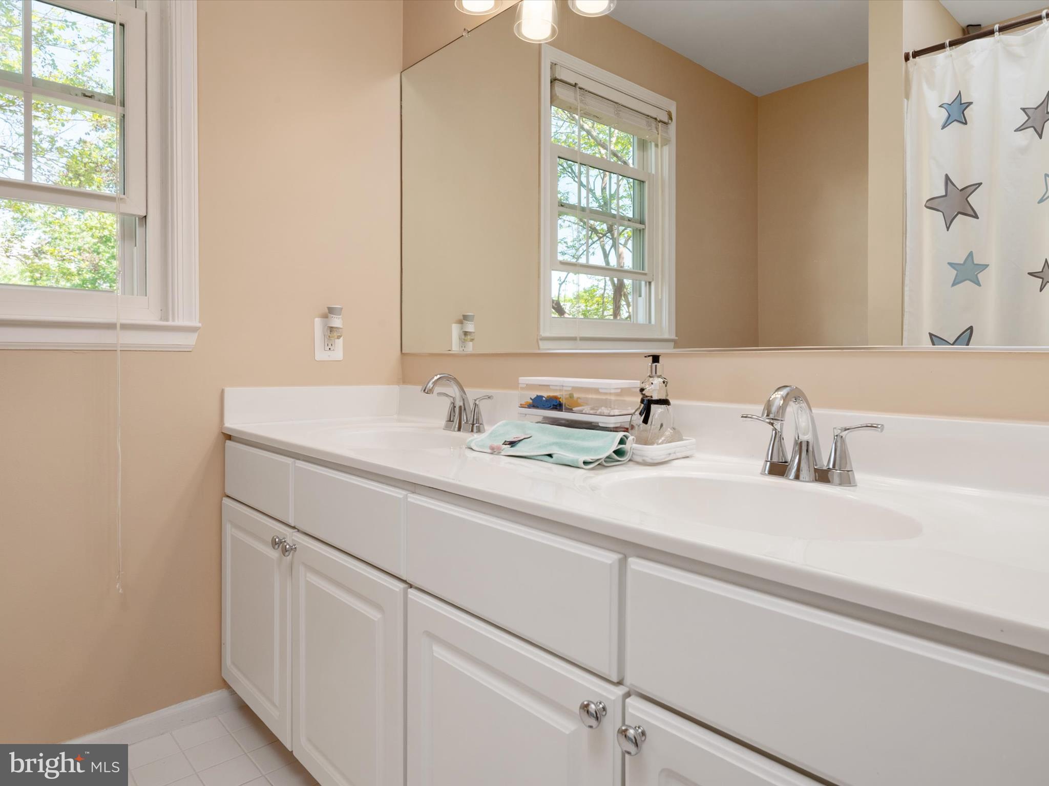 2322 Golden Chapel Road Odenton, MD 21113 - Photo 27 of 64 a bathroom with a sink and a mirror