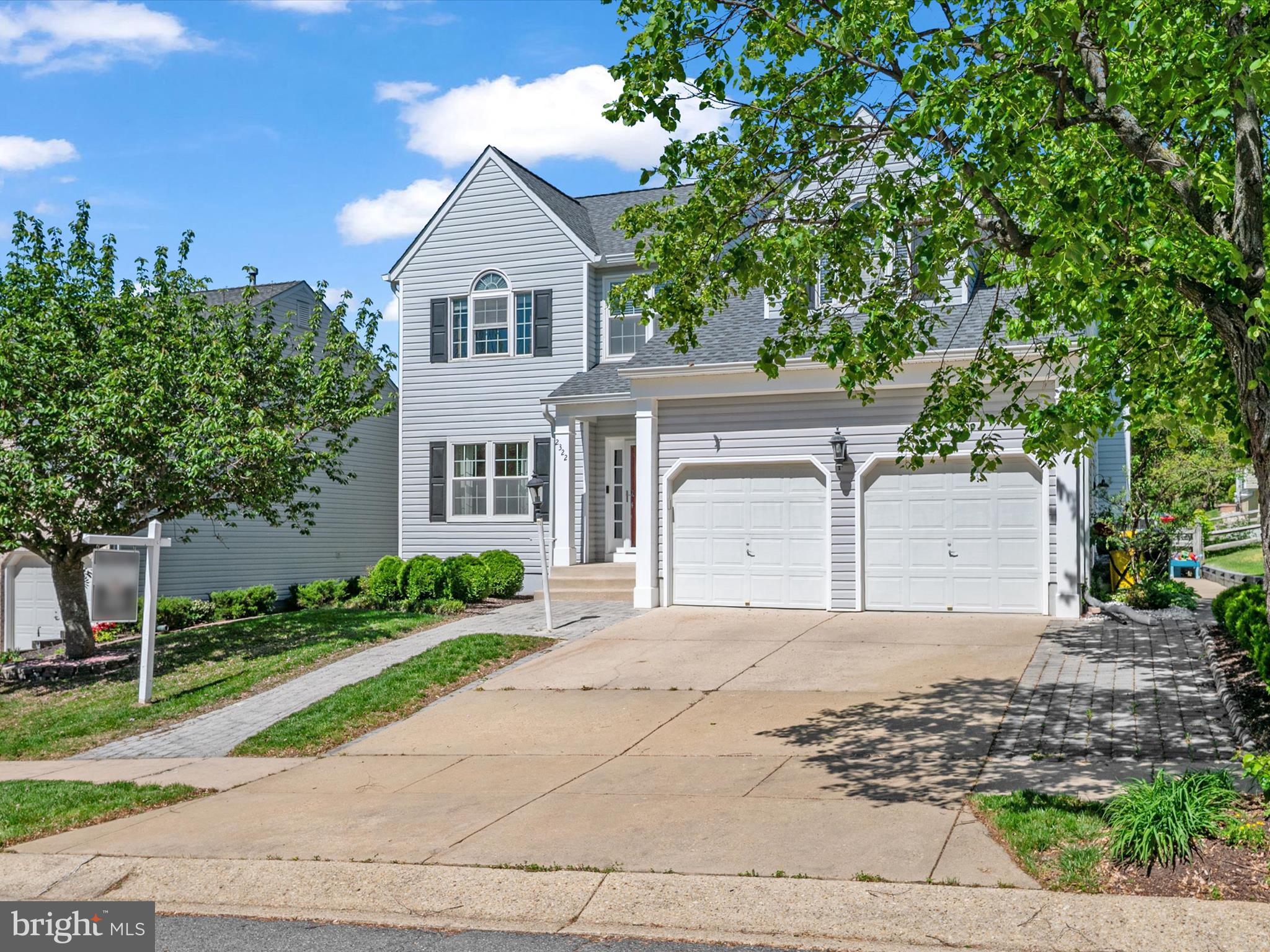 2322 Golden Chapel Road Odenton, MD 21113 - Photo 3 of 64 a front view of a house with a garden and trees
