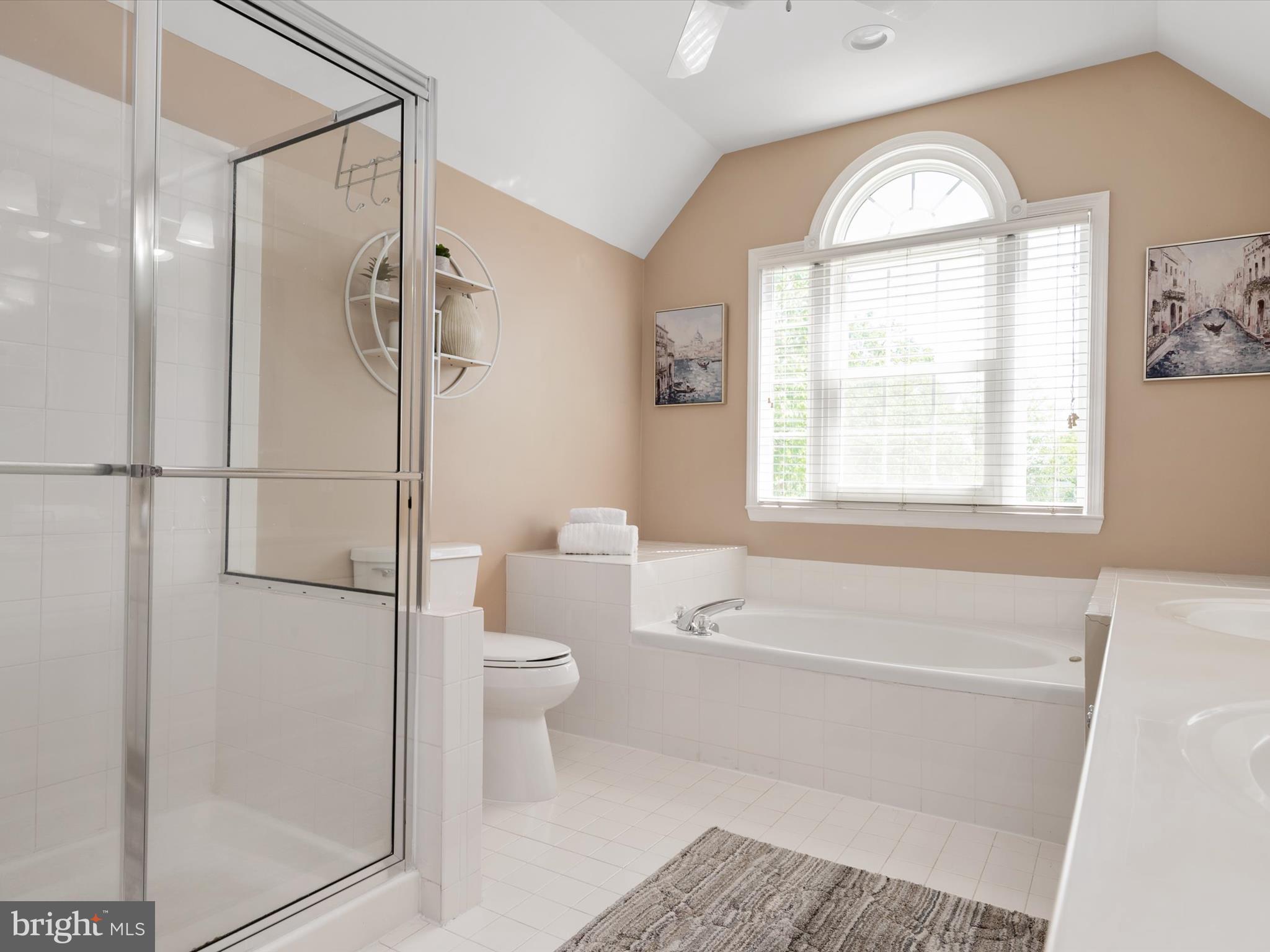2322 Golden Chapel Road Odenton, MD 21113 - Photo 34 of 64 a bathroom with a bathtub a toilet and a shower