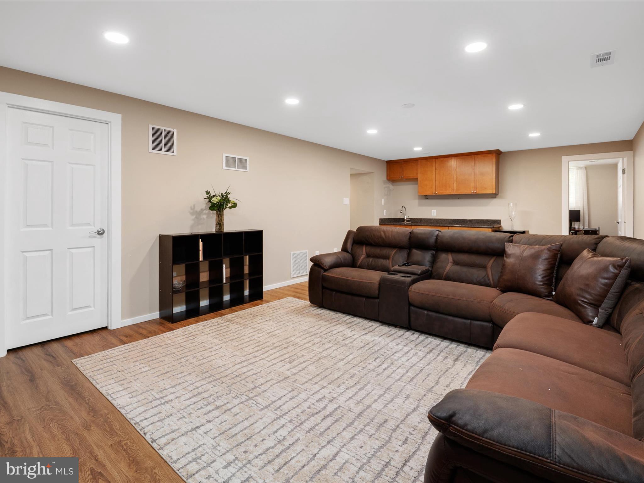 2322 Golden Chapel Road Odenton, MD 21113 - Photo 38 of 64 a living room with furniture and a wooden floor