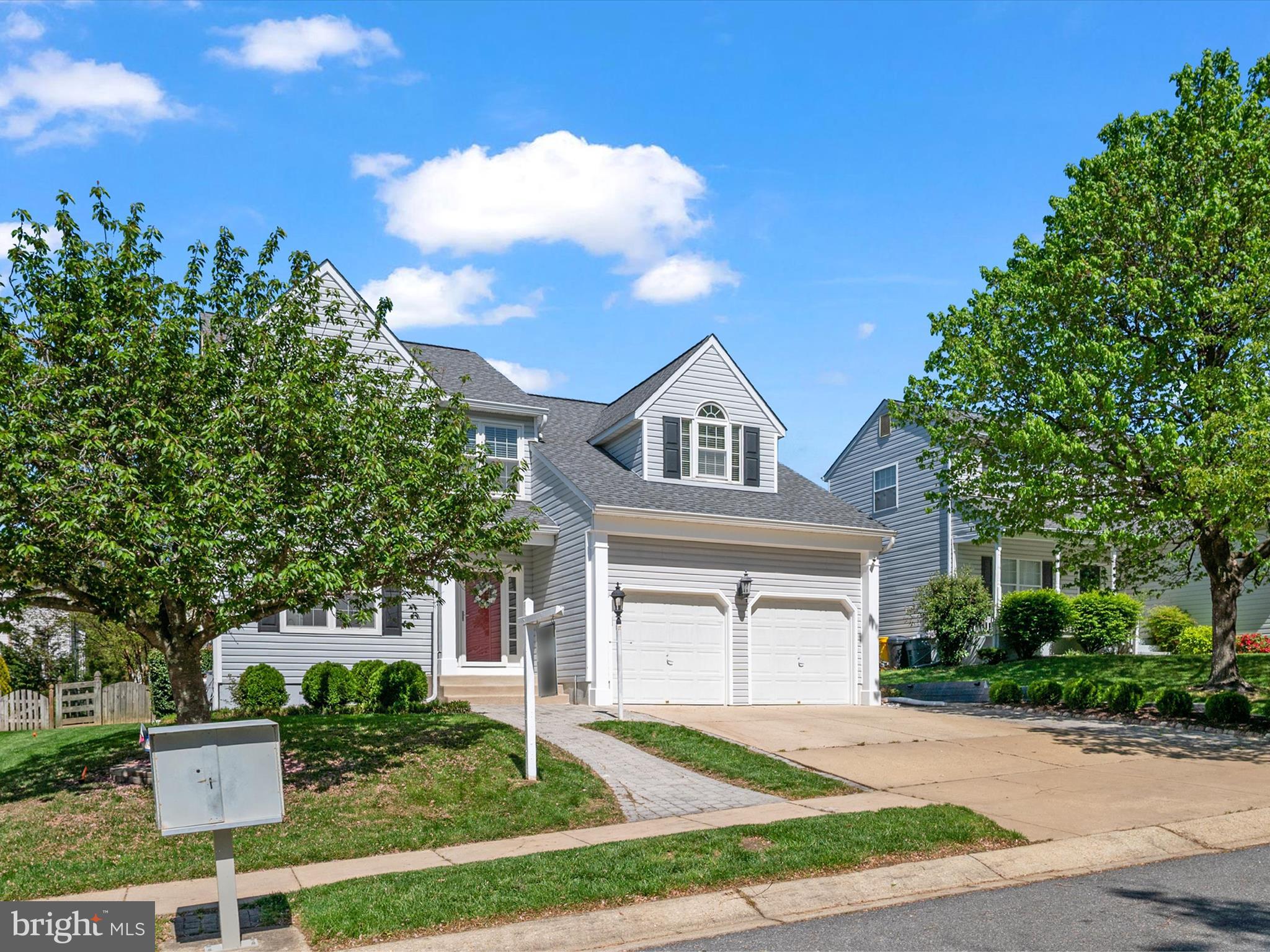 2322 Golden Chapel Road Odenton, MD 21113 - Photo 4 of 64 a front view of a house with a yard and trees