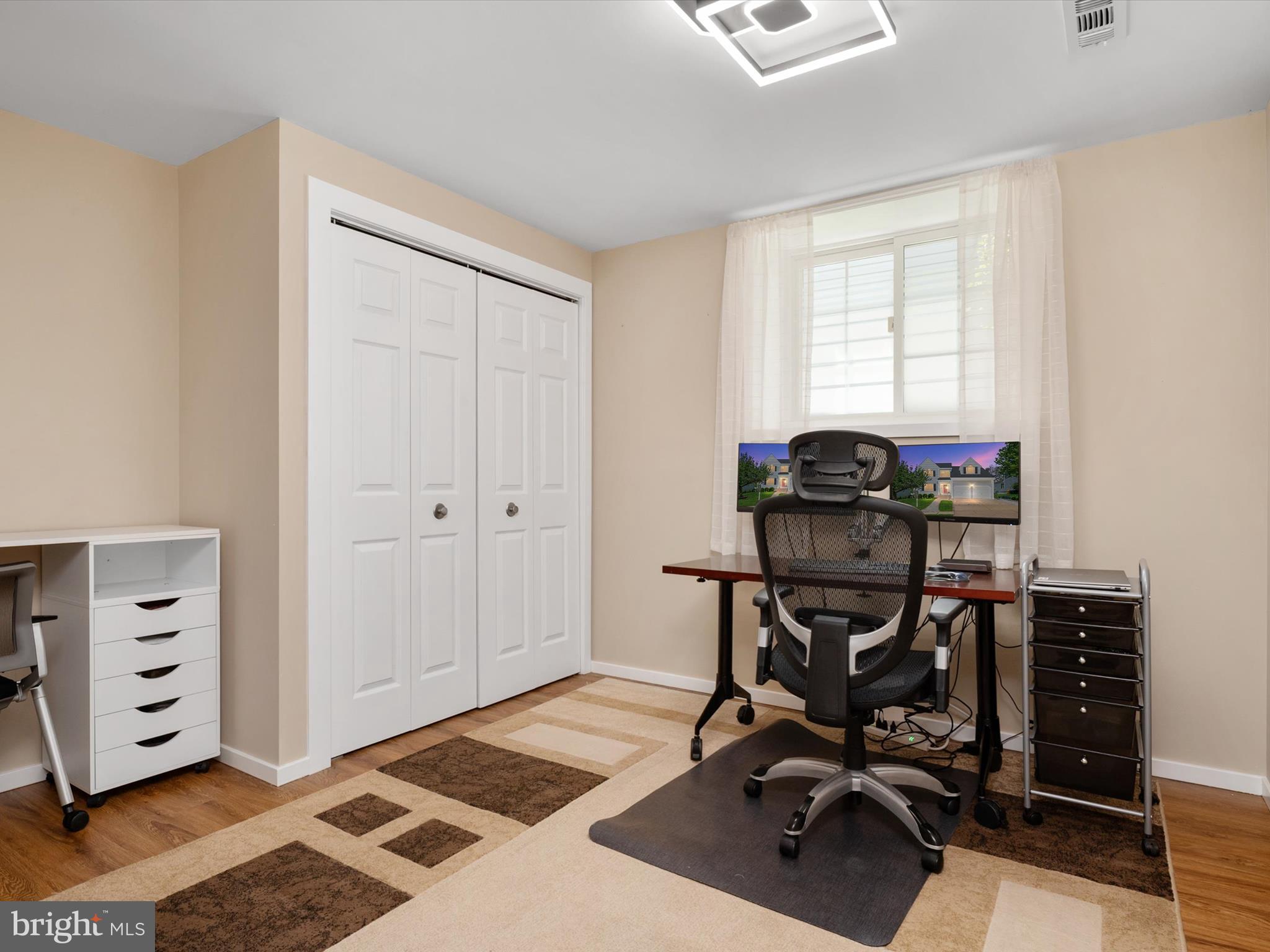 2322 Golden Chapel Road Odenton, MD 21113 - Photo 43 of 64 a view of a workspace with furniture and a window