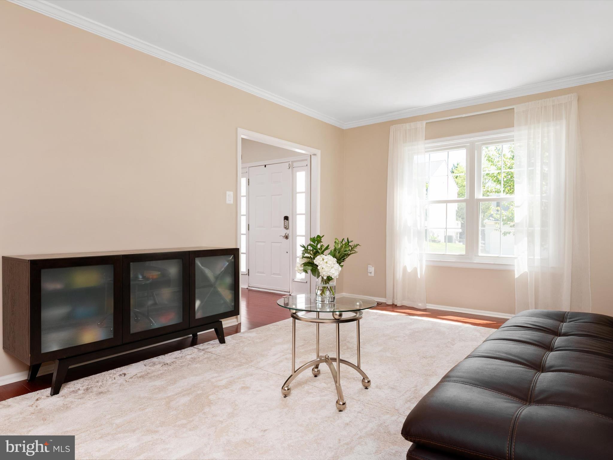 2322 Golden Chapel Road Odenton, MD 21113 - Photo 10 of 64 a living room with furniture a window and a fireplace