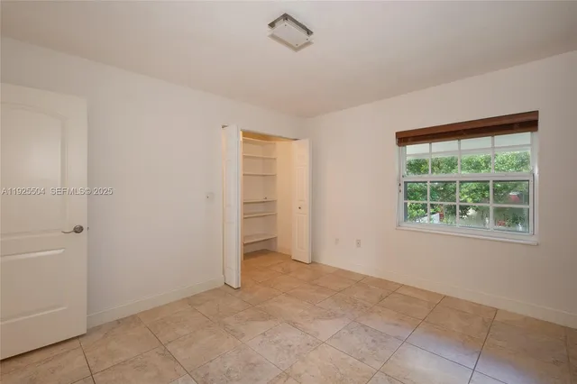 a bathroom with a sink toilet a mirror and shower