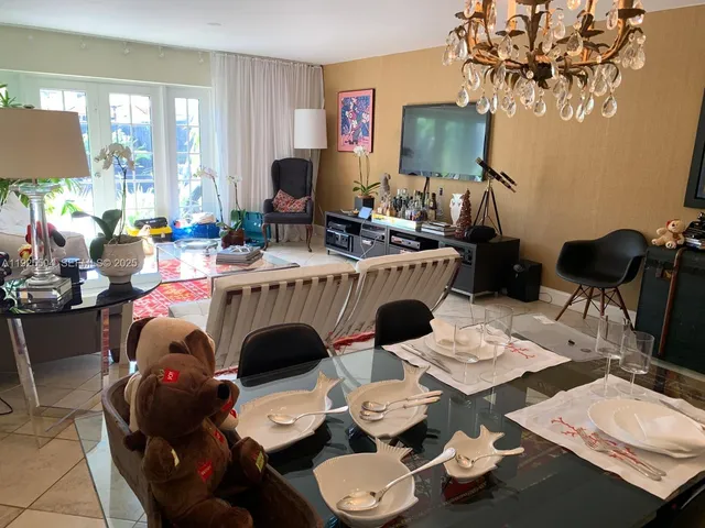 a living room with furniture and a lamp