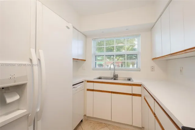 a kitchen with a sink and a window