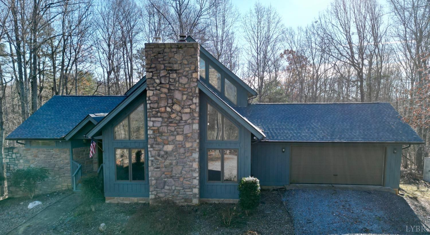 1739 Old Cifax Road Goode, VA 24556 - Photo 1 of 52 a view of backyard of house and trees