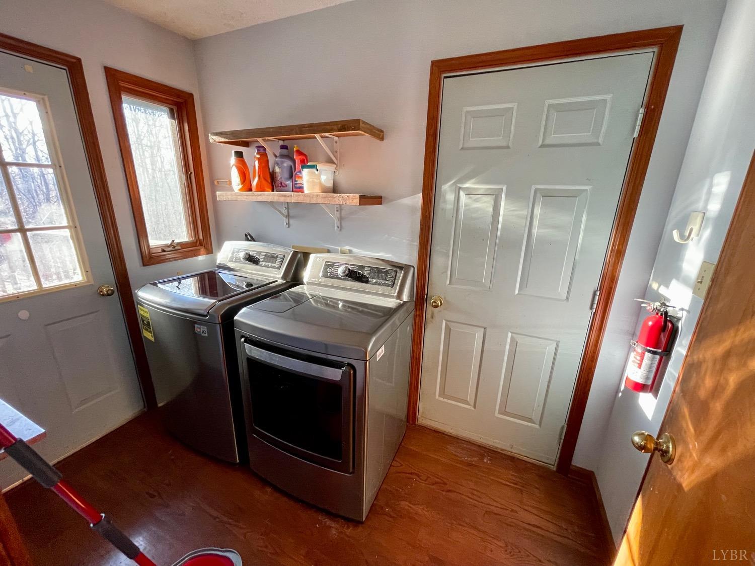 1739 Old Cifax Road Goode, VA 24556 - Photo 16 of 52 a utility room with wooden floor washer and dryer