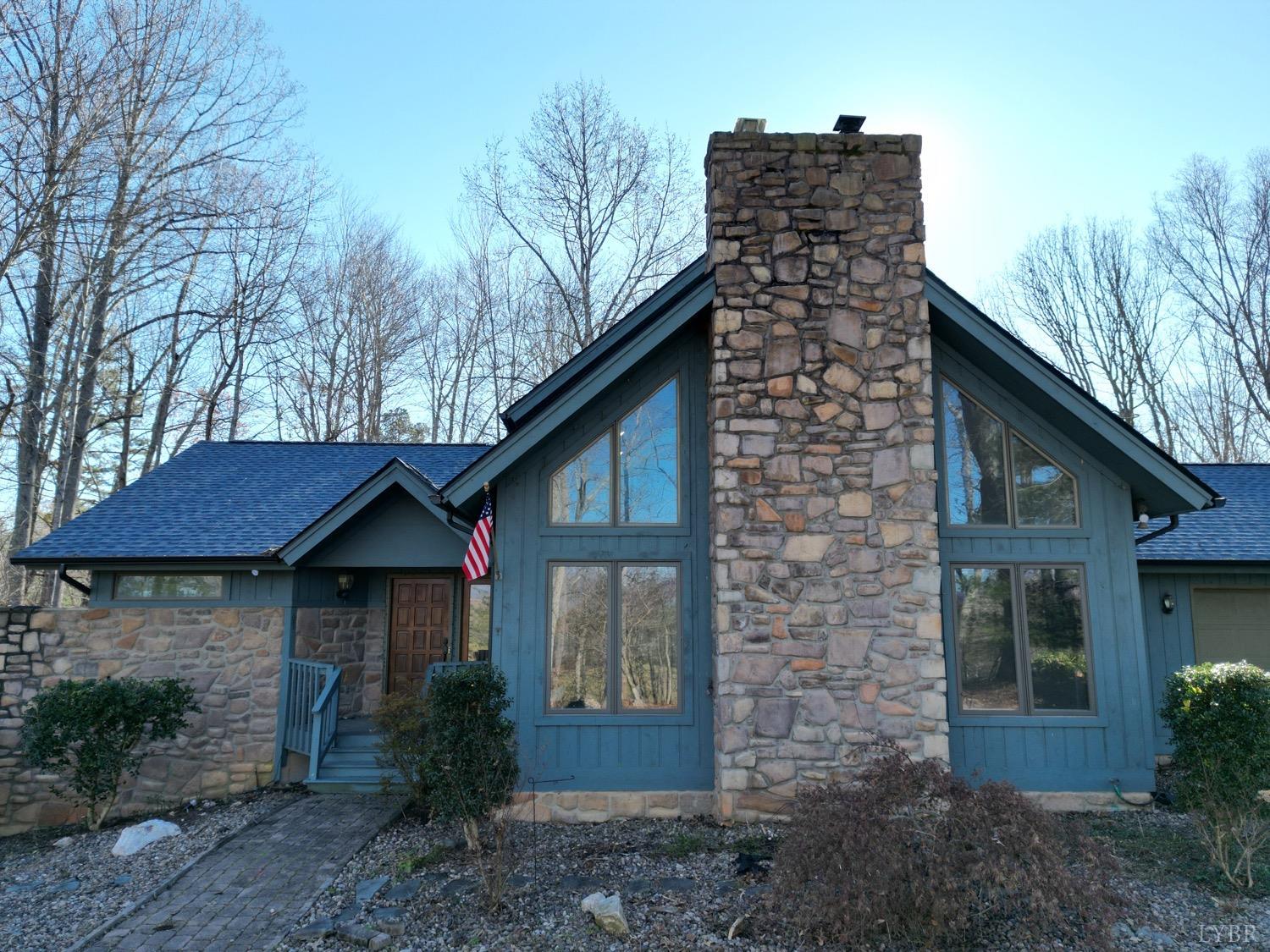 1739 Old Cifax Road Goode, VA 24556 - Photo 2 of 52 a front view of a house with garden