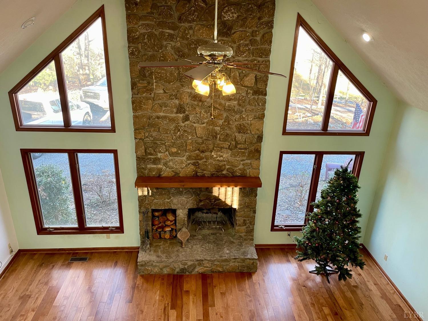 1739 Old Cifax Road Goode, VA 24556 - Photo 28 of 52 a living room with furniture and a fireplace