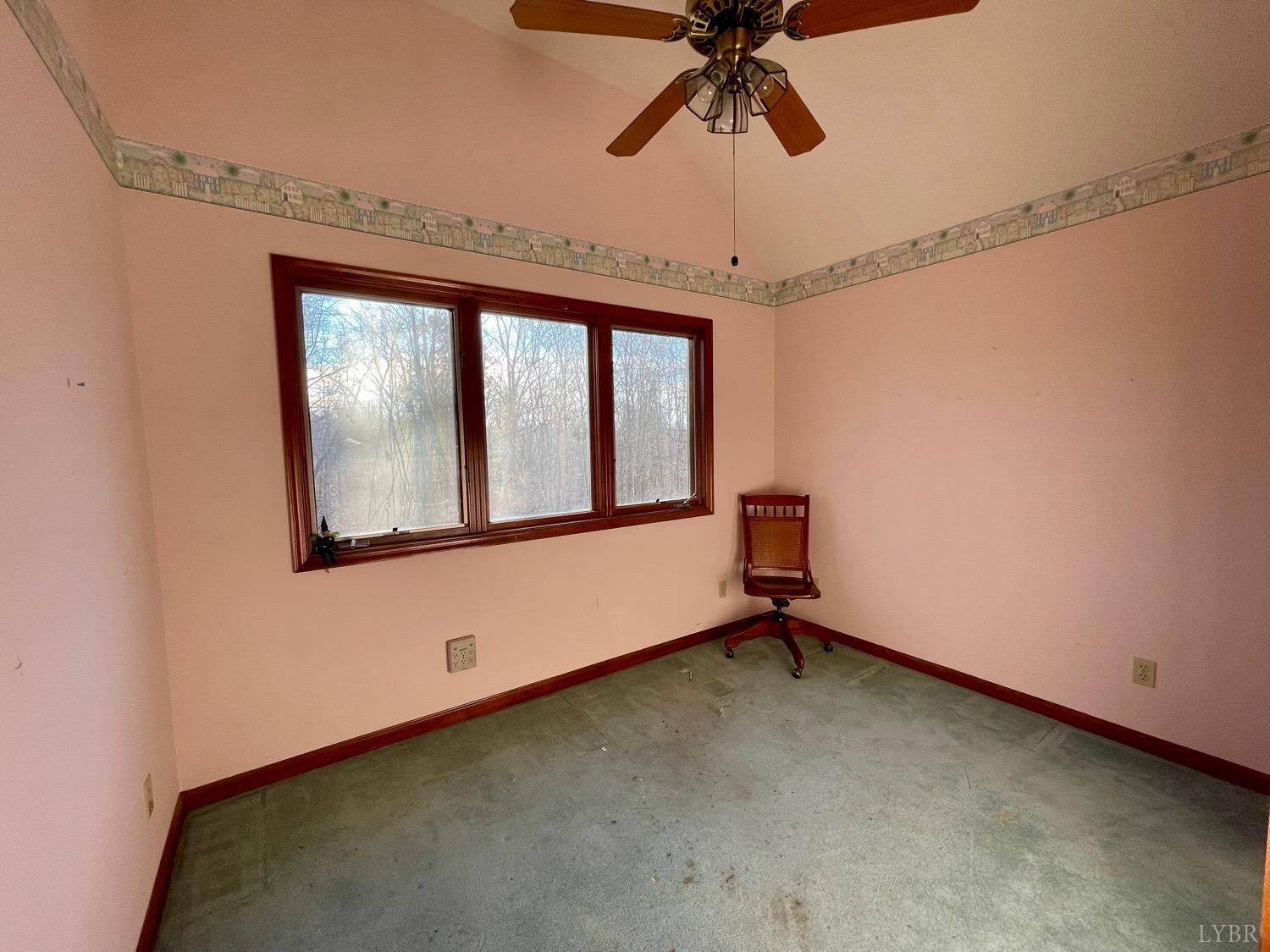 1739 Old Cifax Road Goode, VA 24556 - Photo 32 of 52 a room with a window and ceiling fan