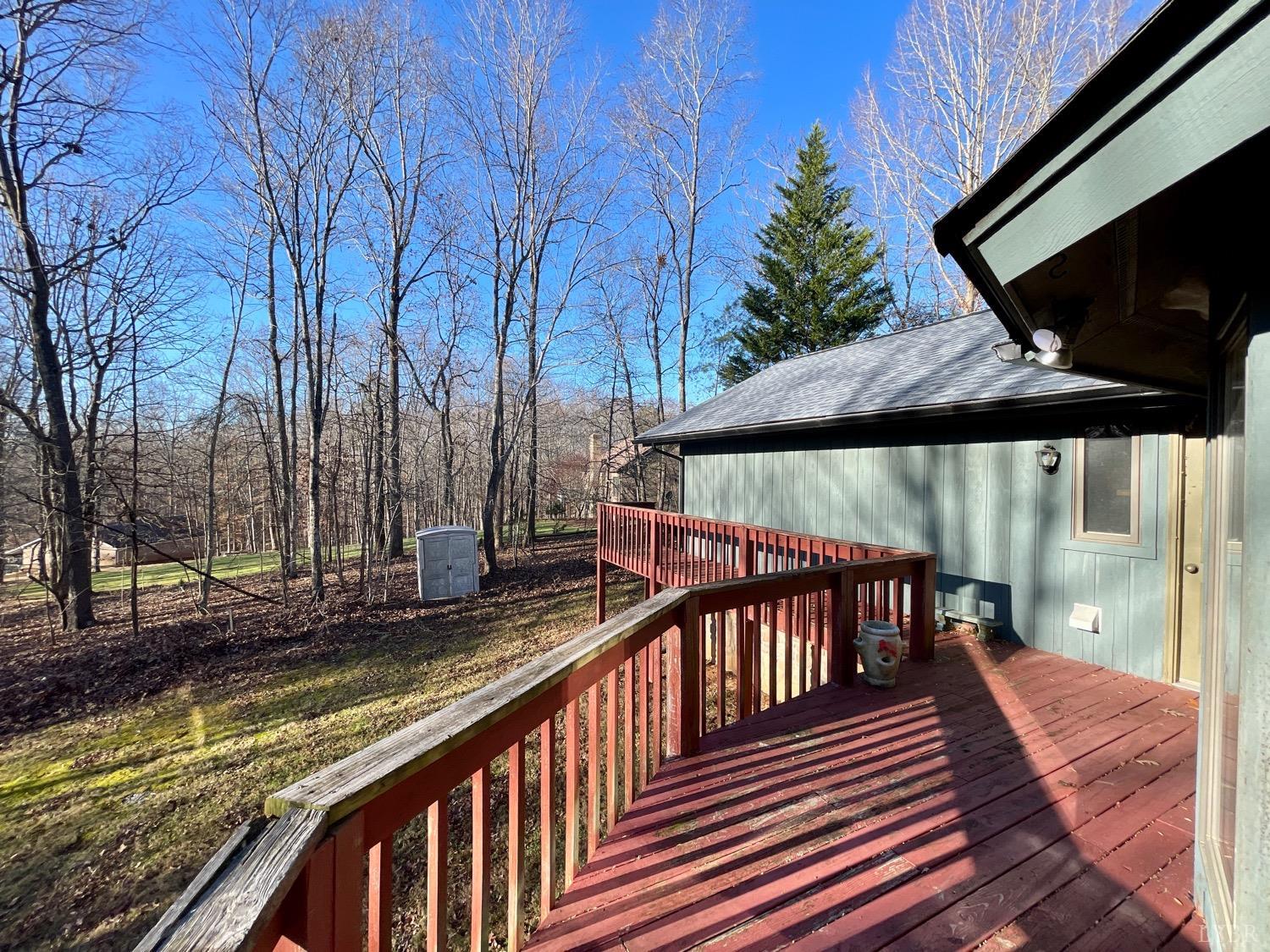 1739 Old Cifax Road Goode, VA 24556 - Photo 41 of 52 a view of balcony with wooden floor and outdoor seating