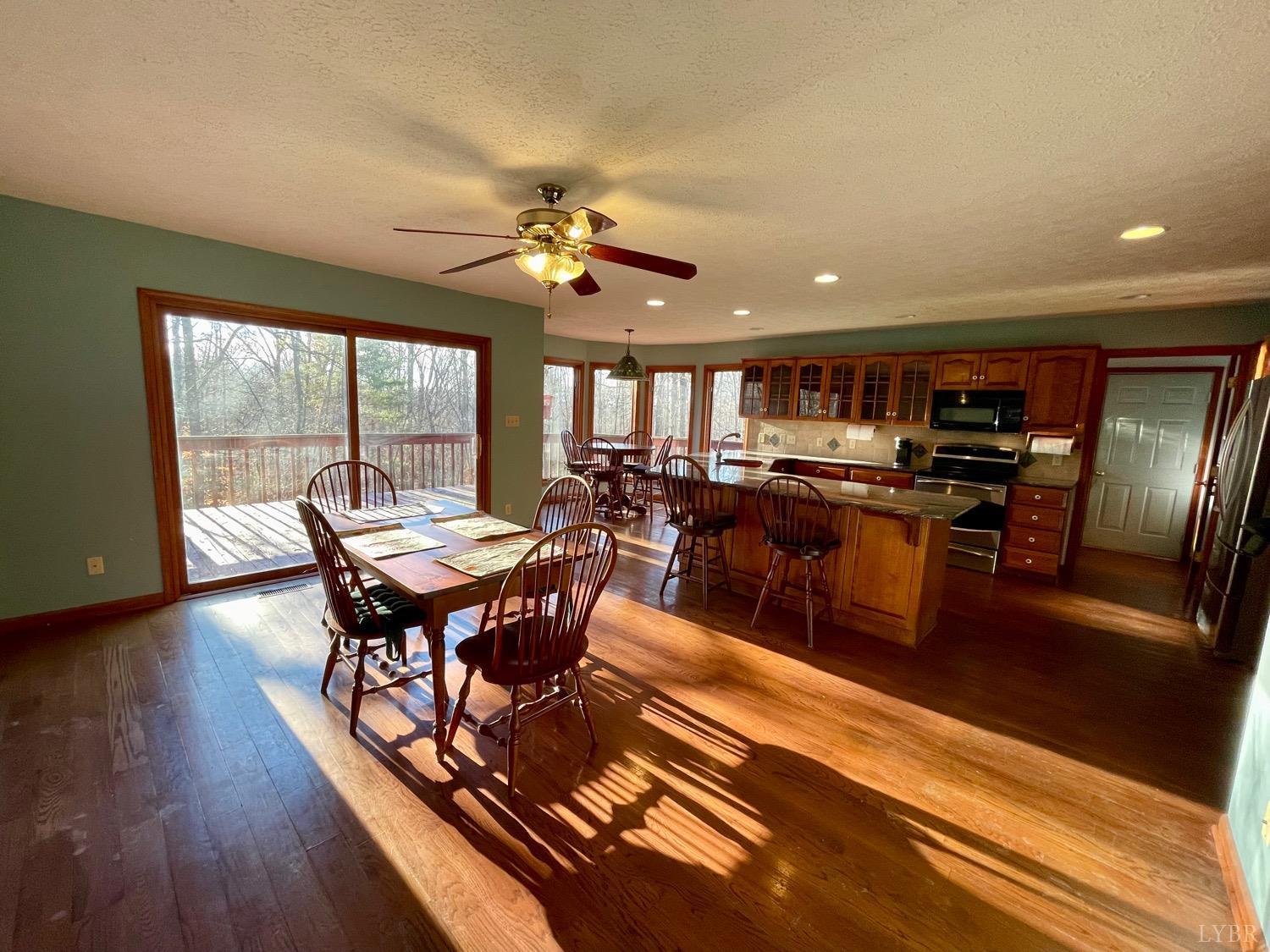 1739 Old Cifax Road Goode, VA 24556 - Photo 10 of 52 a view of a dining room with furniture window and wooden floor