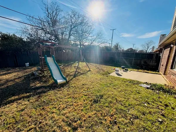 a view of a backyard of the house