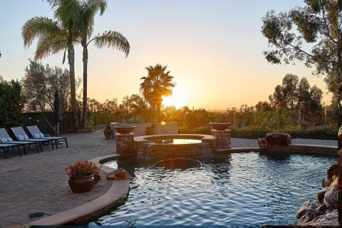 a view of a swimming pool and lounge chair