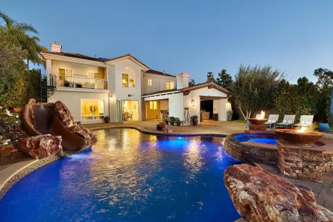 a view of a swimming pool with sitting area