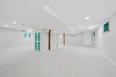 a view of an empty room with a stairs