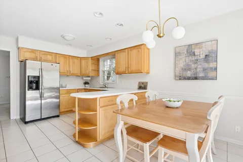 a kitchen with a sink appliances and cabinets
