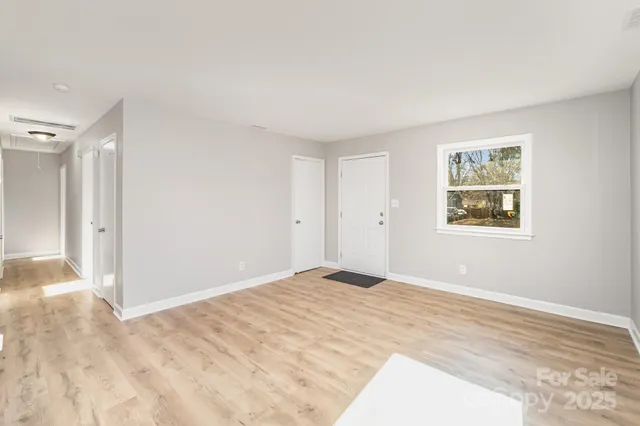 a view of room with window and ceiling fan