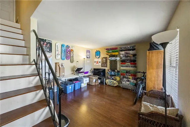 a view of a livingroom with hardwood and furniture