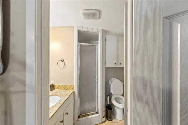 a view of a bathroom from a hallway