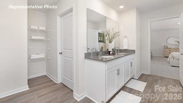 a bathroom with a sink a mirror and a toilet
