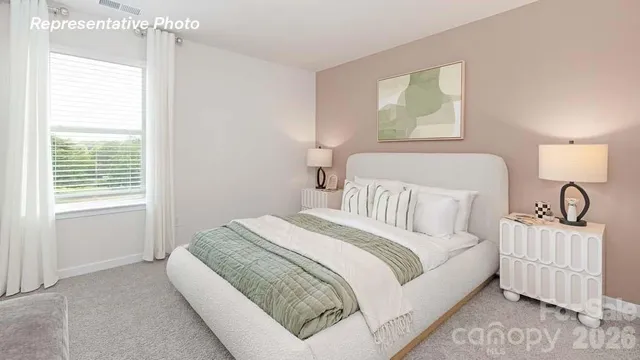 a bed room with a bed and a window