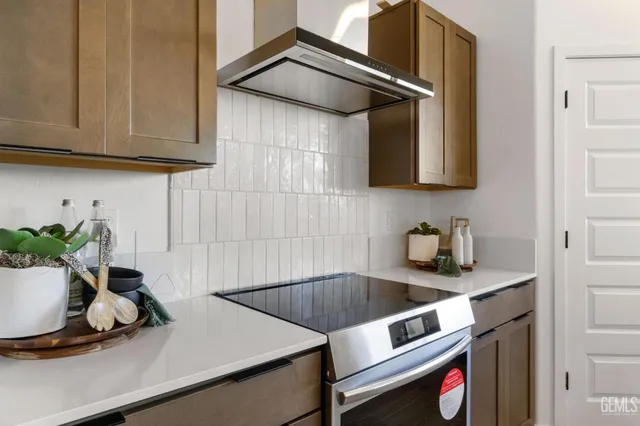 a kitchen with a sink and a stove top oven