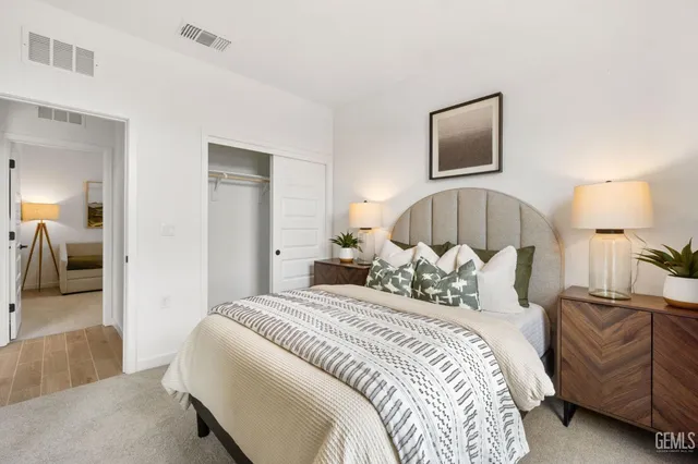 a bedroom with a bed and walk in closet