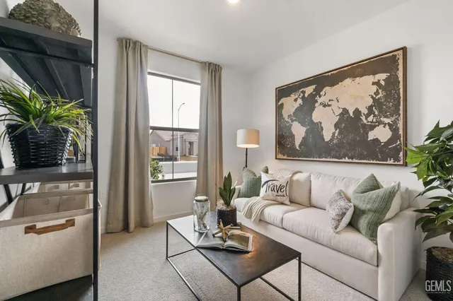 a living room with furniture and a large window